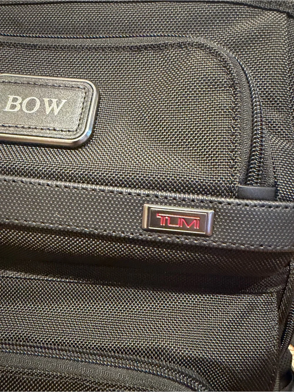 Tumi Black Backpack with Multiple Front Pockets